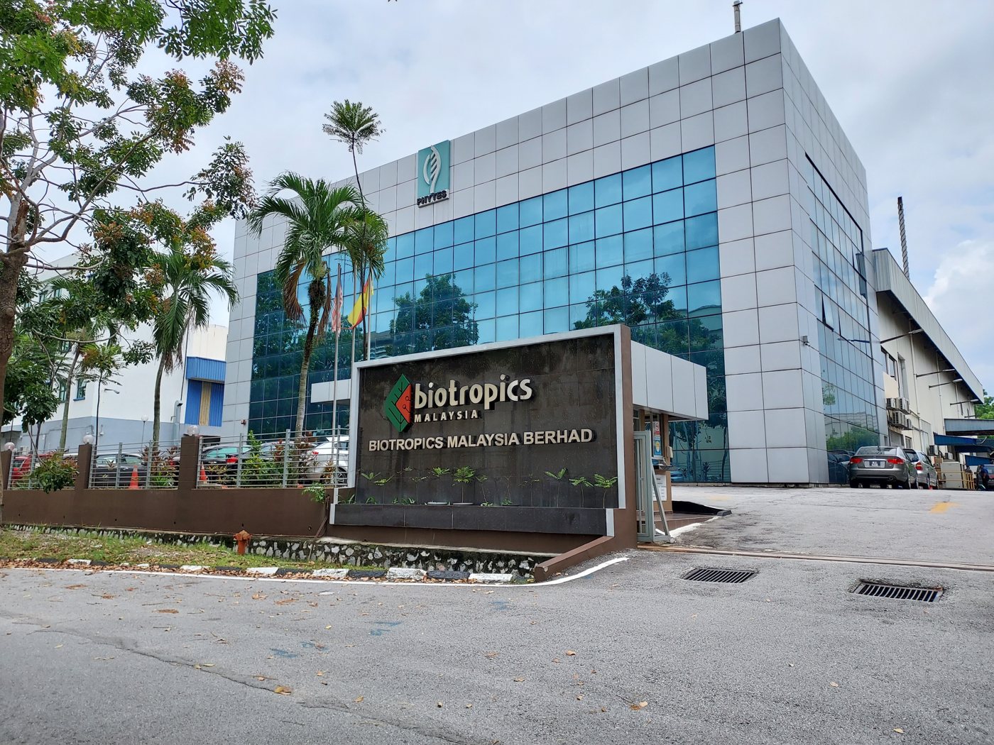 The Biotropics headquarters in Shah Alam, with the company sign in front and the Phytes logo on the building