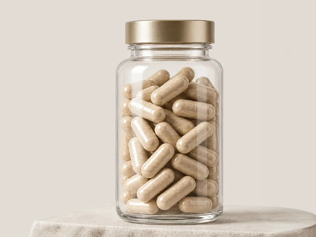 A glass jar filled with Physta capsules