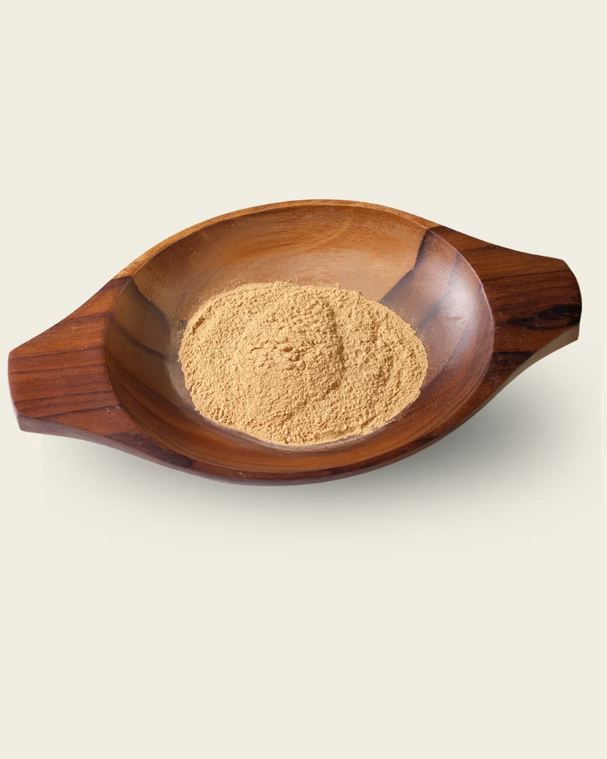Physta Tongkat Ali extract powder in a wooden bowl